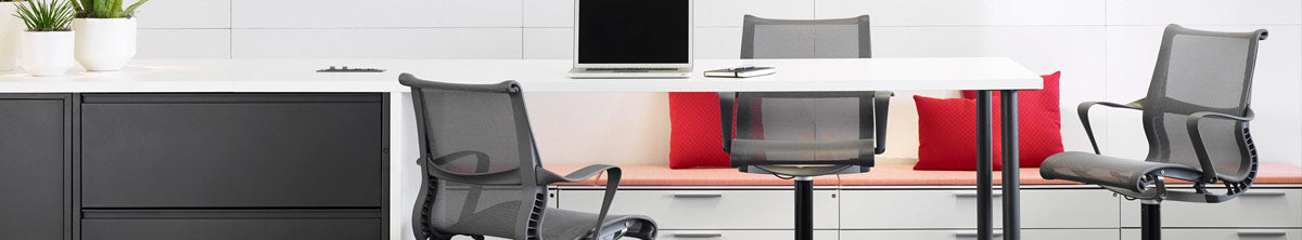 Two grey Setu Stools at a meeting space